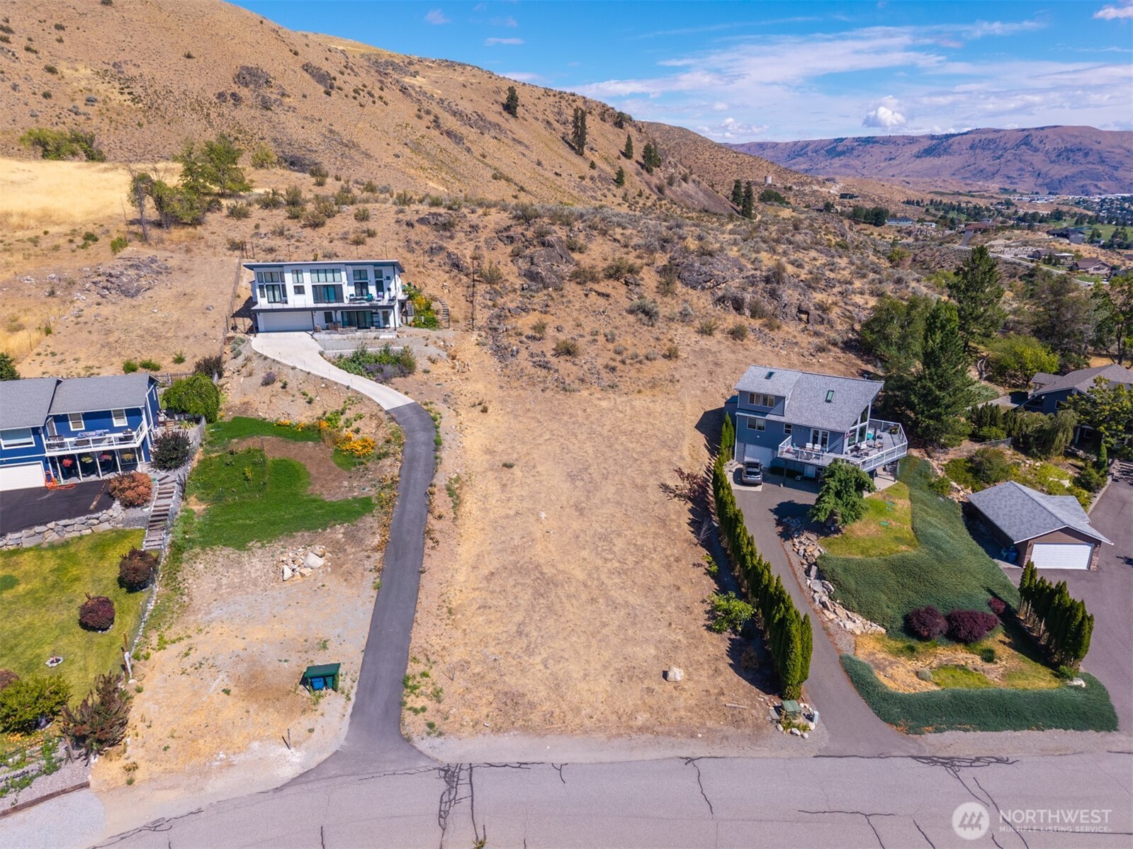 211 Pinnacle Place Chelan, WA 98816 - Photo 2 of 28 an aerial view of residential houses with outdoor space