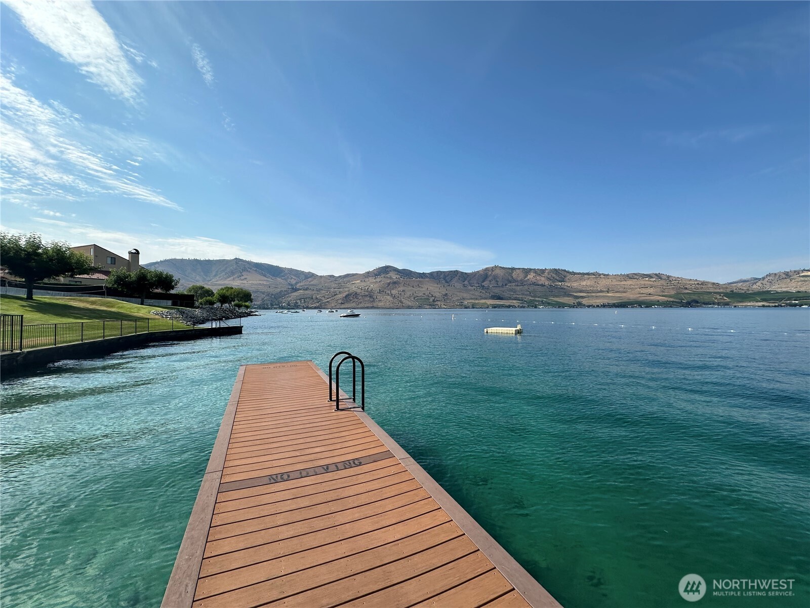 211 Pinnacle Place Chelan, WA 98816 - Photo 22 of 28 a view of a lake with a yard