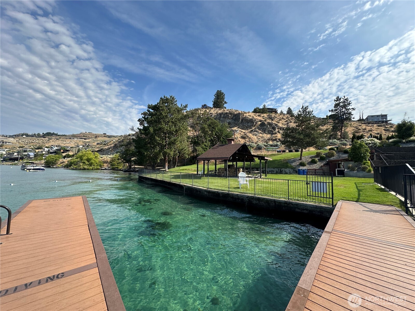 211 Pinnacle Place Chelan, WA 98816 - Photo 23 of 28 a view of a lake with a yard