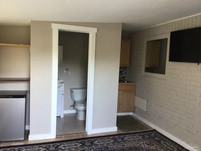 a bathroom with a sink and a stove