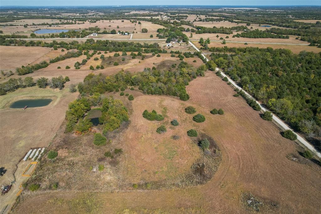 6504 Interstate 30 Campbell, TX 75422 - Photo 10 of 13 an aerial view of residential houses with outdoor space