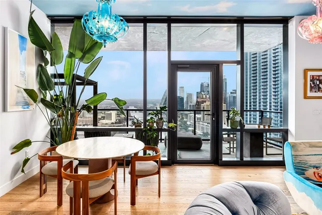 a view of a dining room with furniture window and wooden floor