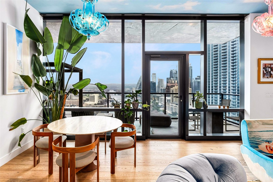 a view of a dining room with furniture window and wooden floor