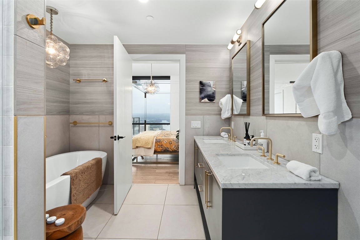 70 Rainey Street, Unit 2702 Austin, TX 78701 - Photo 16 of 40 a bathroom with a sink a toilet and shower