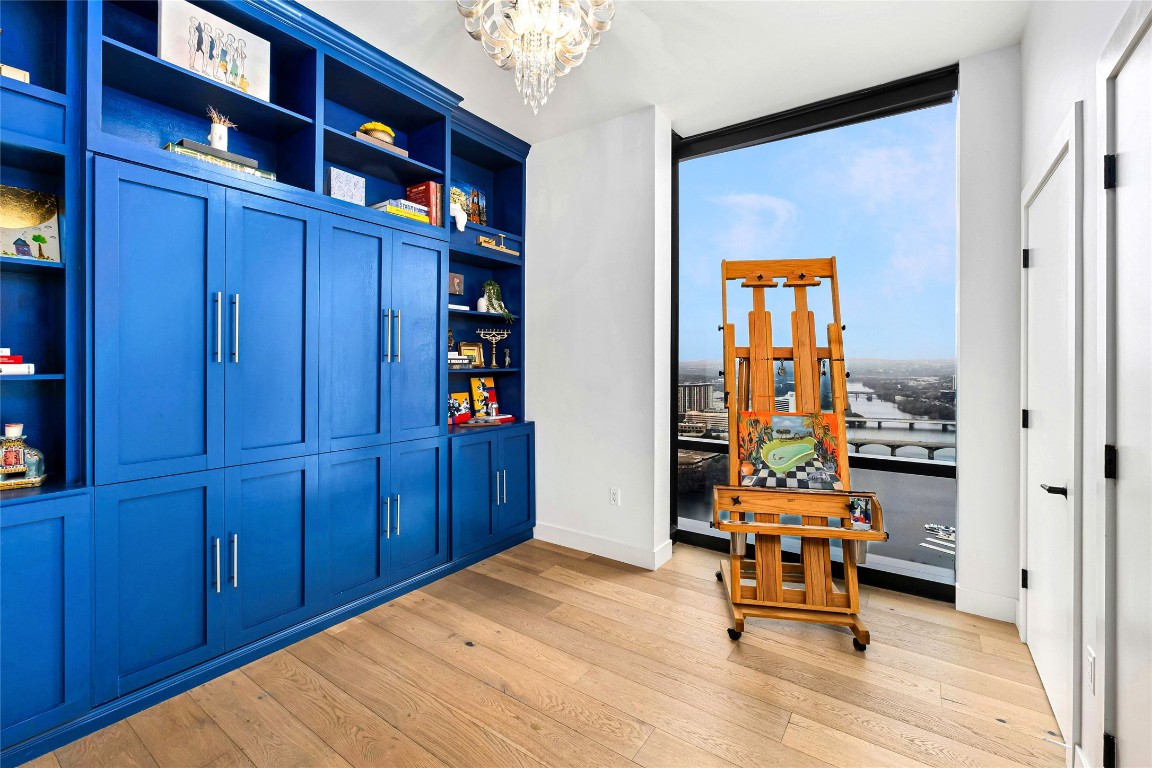 70 Rainey Street, Unit 2702 Austin, TX 78701 - Photo 20 of 40 a room with wooden furniture and window