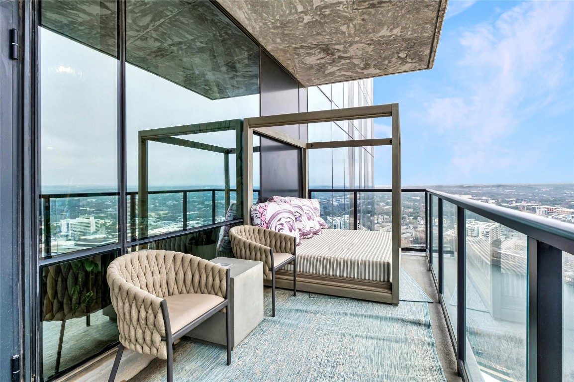 70 Rainey Street, Unit 2702 Austin, TX 78701 - Photo 23 of 40 a bedroom with furniture and a large window