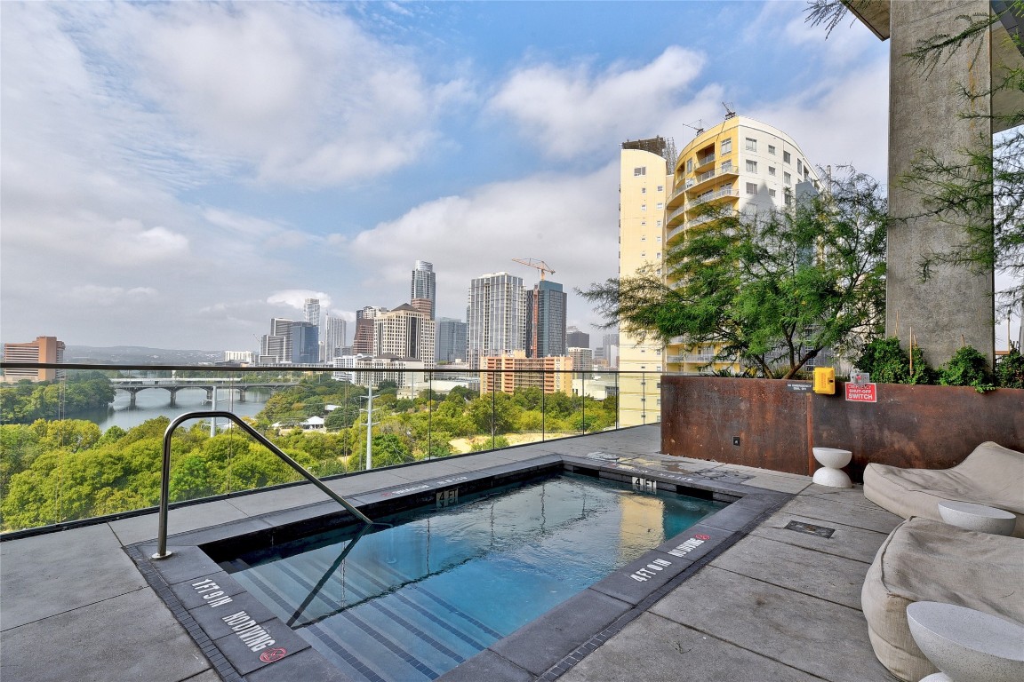 70 Rainey Street, Unit 2702 Austin, TX 78701 - Photo 32 of 40 a view of swimming pool with a patio and a yard