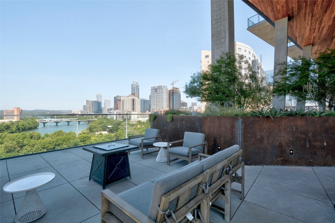 70 Rainey Street, Unit 2702 Austin, TX 78701 - Photo 38 of 40 a view of a terrace with chairs and a table