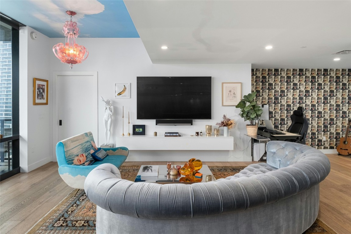 70 Rainey Street, Unit 2702 Austin, TX 78701 - Photo 4 of 40 a living room with furniture and a flat screen tv