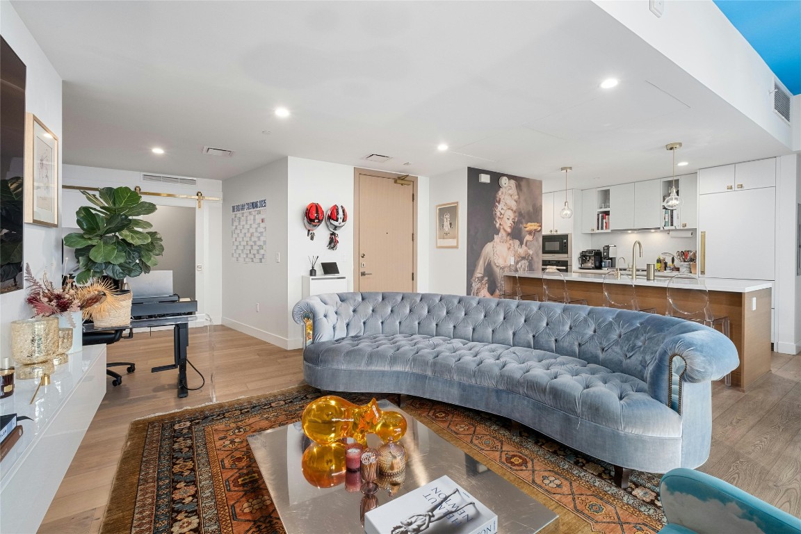 70 Rainey Street, Unit 2702 Austin, TX 78701 - Photo 5 of 40 a living room with furniture and a couch