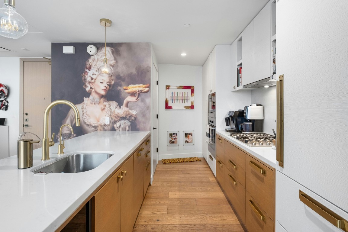 70 Rainey Street, Unit 2702 Austin, TX 78701 - Photo 8 of 40 a large kitchen with stainless steel appliances lots of counter space and a sink