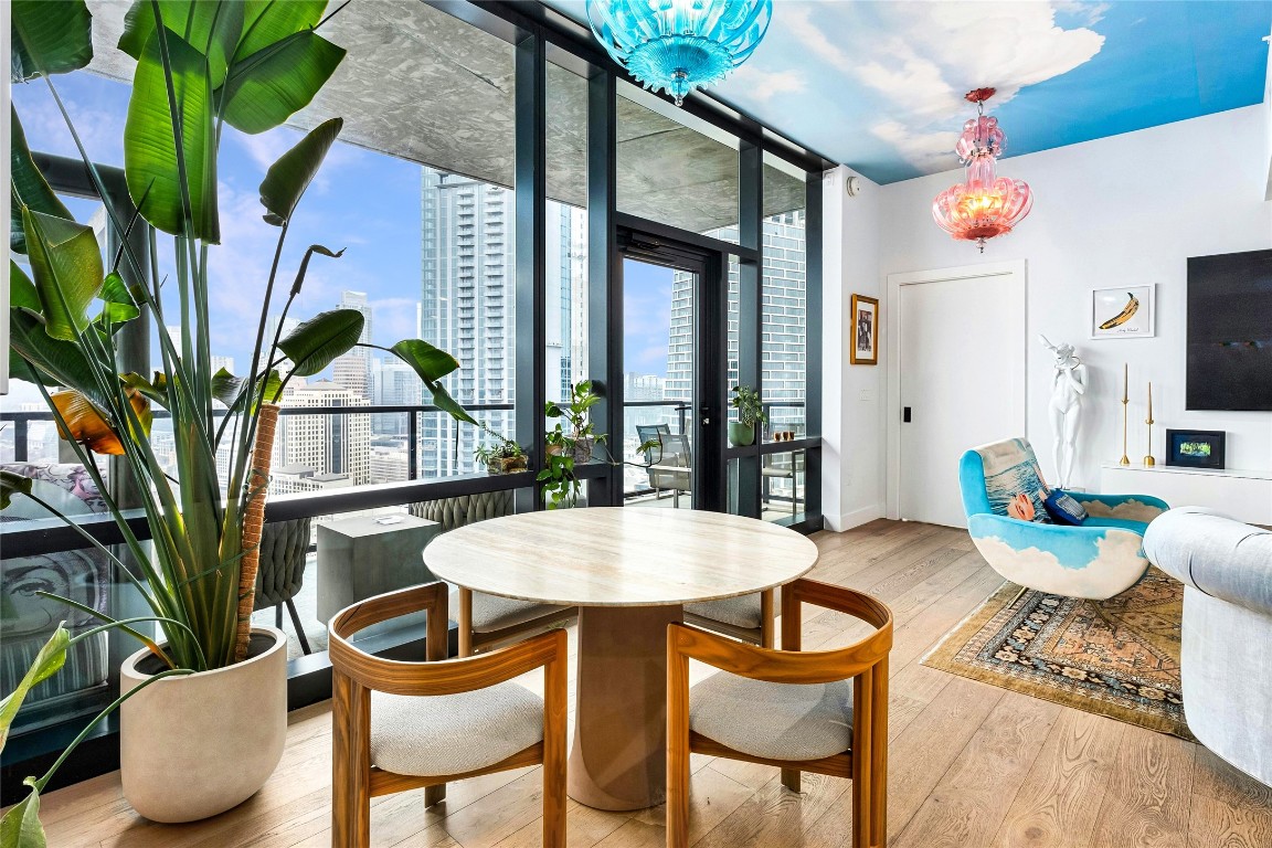 70 Rainey Street, Unit 2702 Austin, TX 78701 - Photo 10 of 40 a dining room with furniture and a potted plant