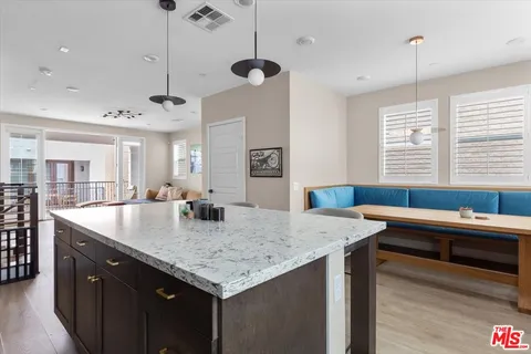 a bedroom with a bed lamp and a window