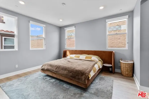 a spacious bathroom with a granite countertop sink mirror and double