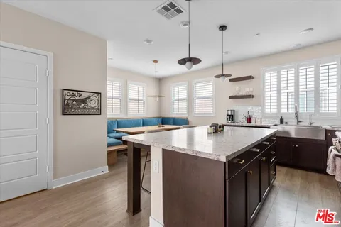 a view of a room that has a table and chairs