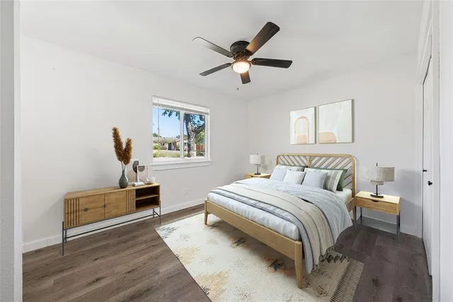 a bedroom with a bed and dresser