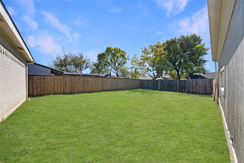 2126 Travis Drive Carrollton, TX 75006 - Photo 23 of 23 a view of yard with green space