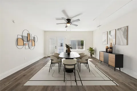 a view of a dining room with furniture window and wooden floor