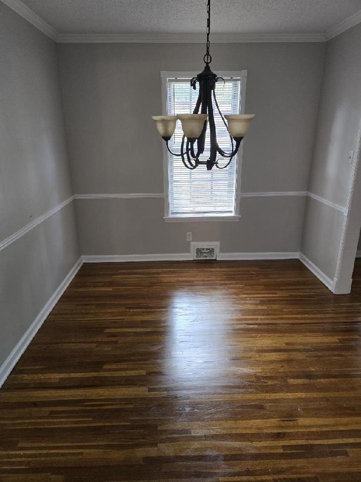 6272 Macon Road Memphis, TN 38134 - Photo 4 of 13 a view of a room with wooden floor and ceiling fan