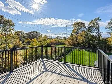 a view of balcony with wooden floor