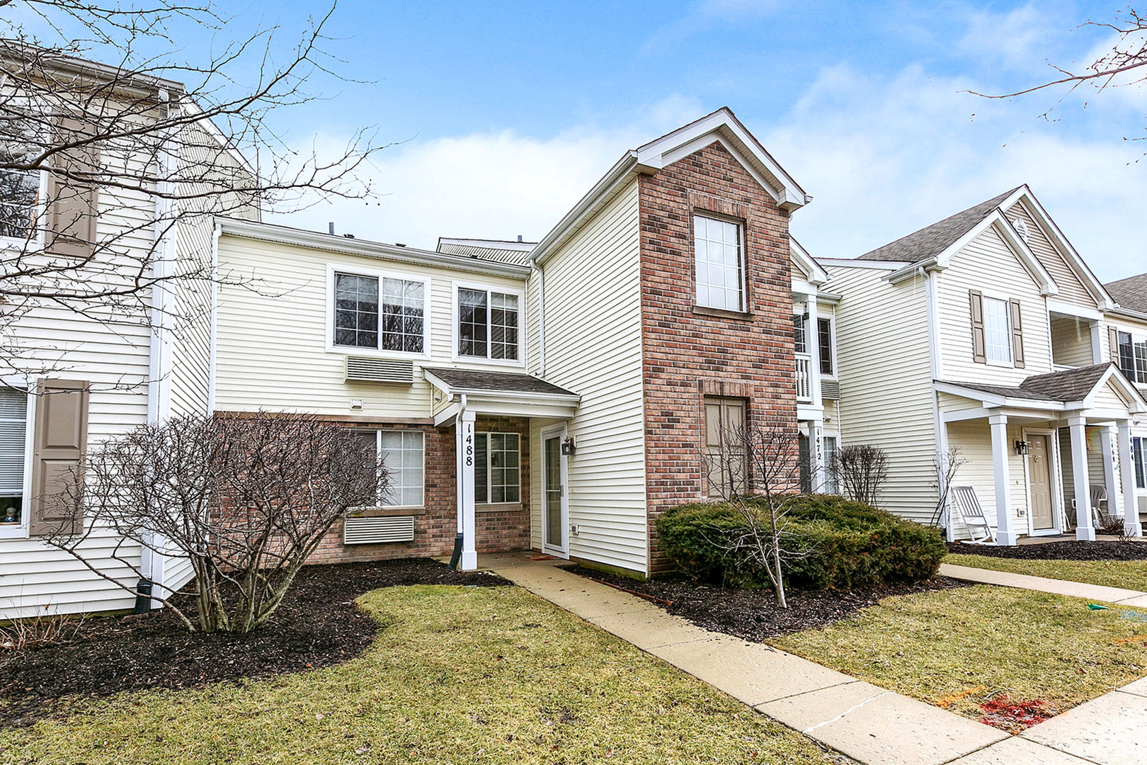 1488 McClure Road, Unit 1488 Aurora, IL 60505 - Photo 2 of 19 a front view of a house with garden
