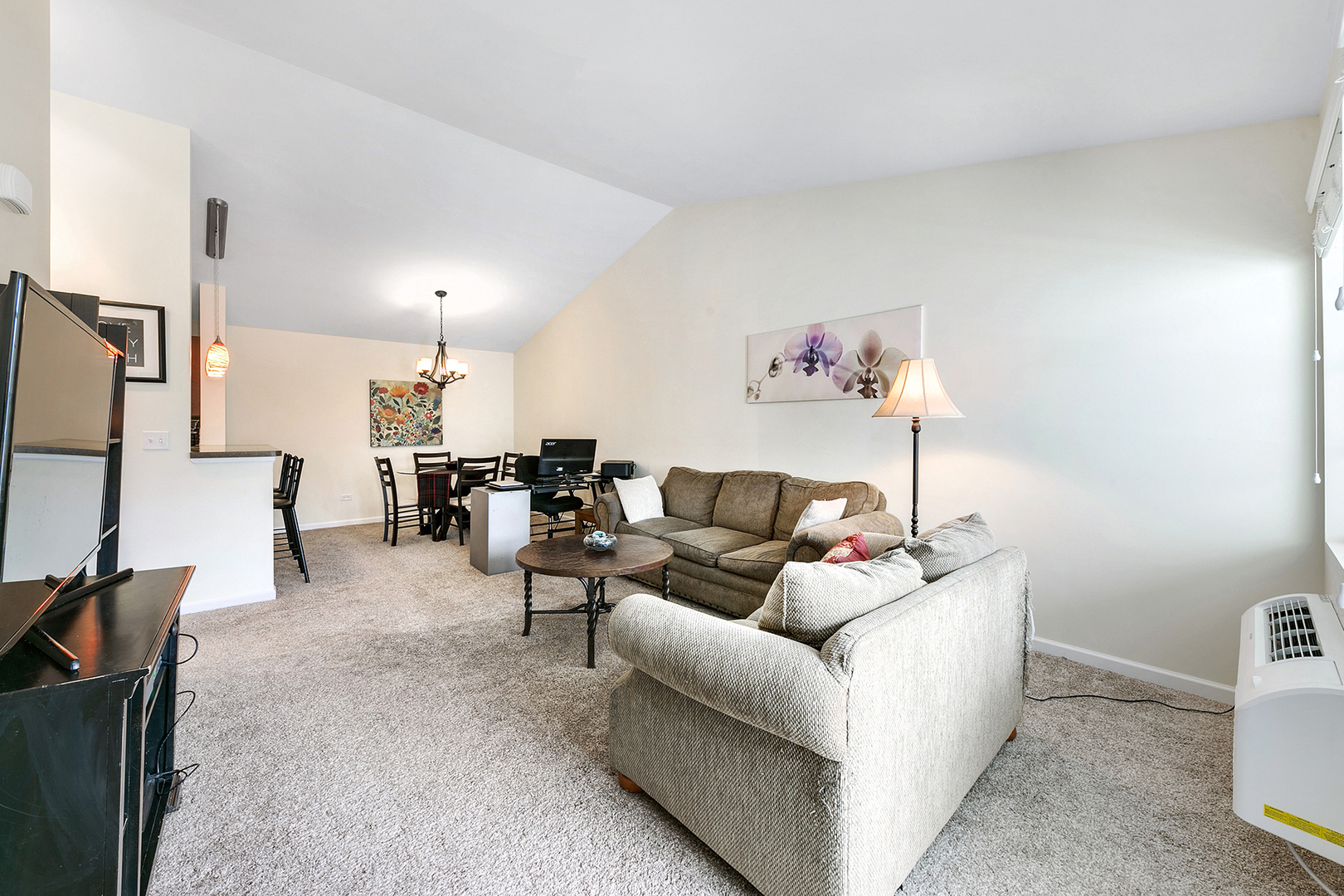 1488 McClure Road, Unit 1488 Aurora, IL 60505 - Photo 11 of 19 a living room with furniture and a flat screen tv