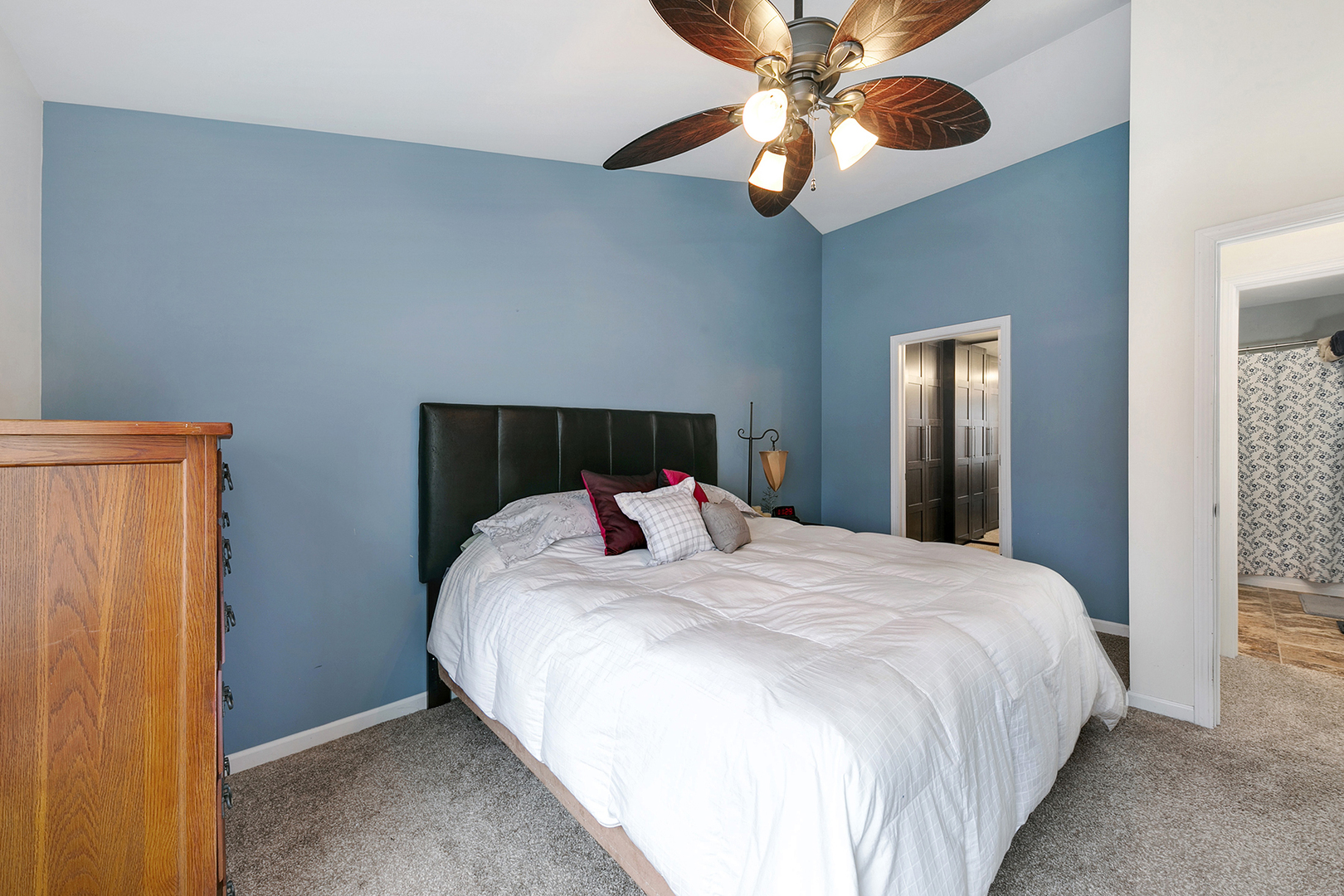 1488 McClure Road, Unit 1488 Aurora, IL 60505 - Photo 12 of 19 a bedroom with a bed and a chandelier