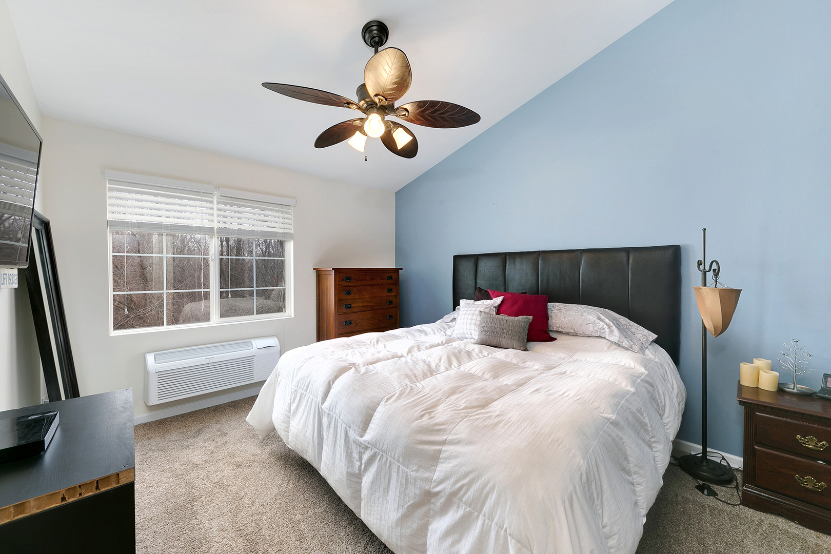 1488 McClure Road, Unit 1488 Aurora, IL 60505 - Photo 13 of 19 a bedroom with a large bed and a large window