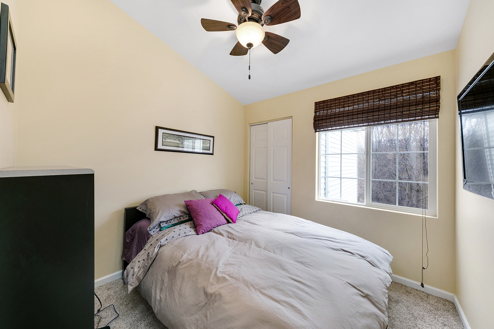 1488 McClure Road, Unit 1488 Aurora, IL 60505 - Photo 15 of 19 a bed in a bedroom next to a window