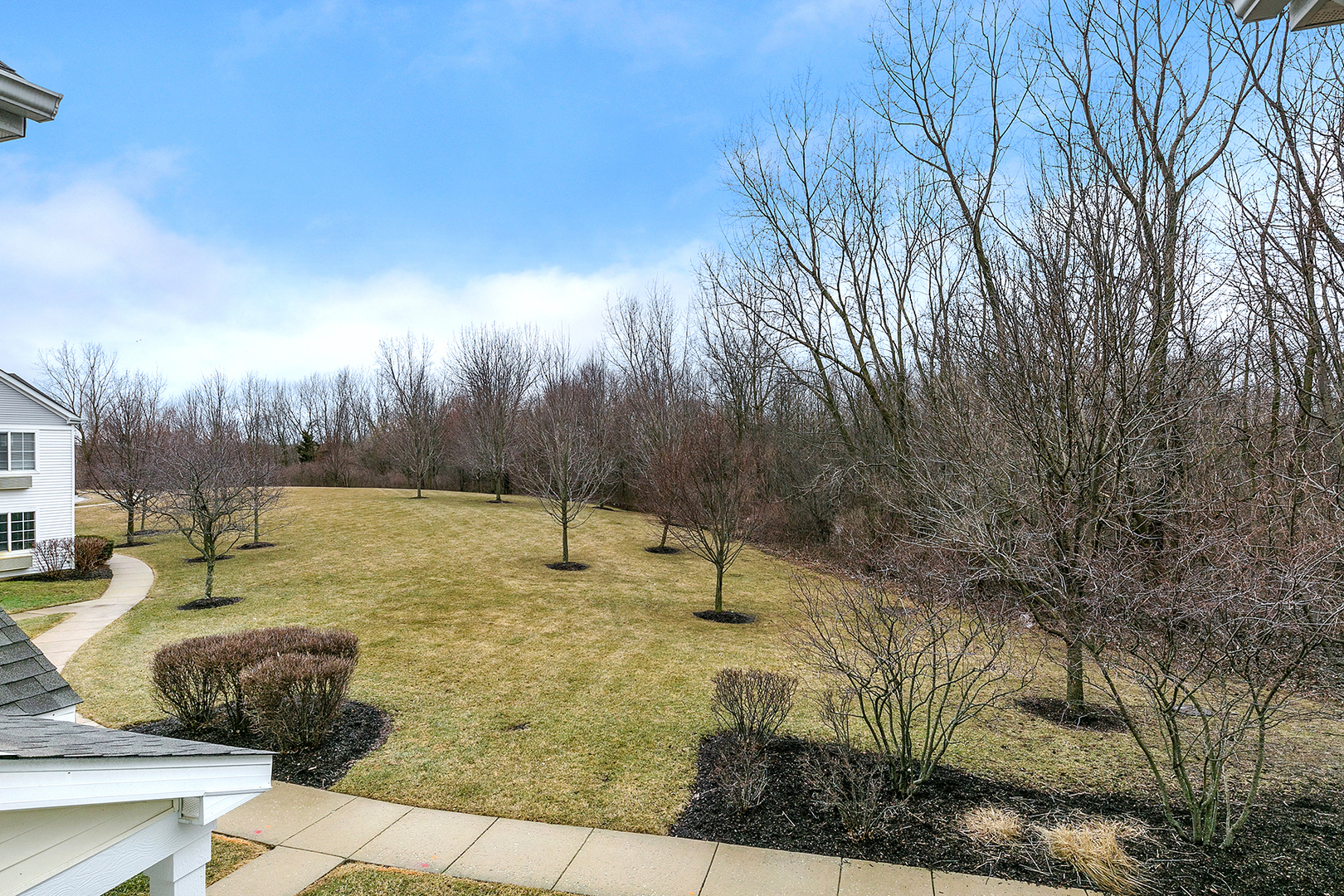 1488 McClure Road, Unit 1488 Aurora, IL 60505 - Photo 18 of 19 a swimming pool with some trees in the background