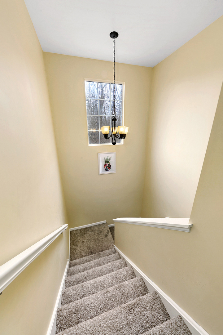 1488 McClure Road, Unit 1488 Aurora, IL 60505 - Photo 3 of 19 a view of entryway and hall with wooden floor