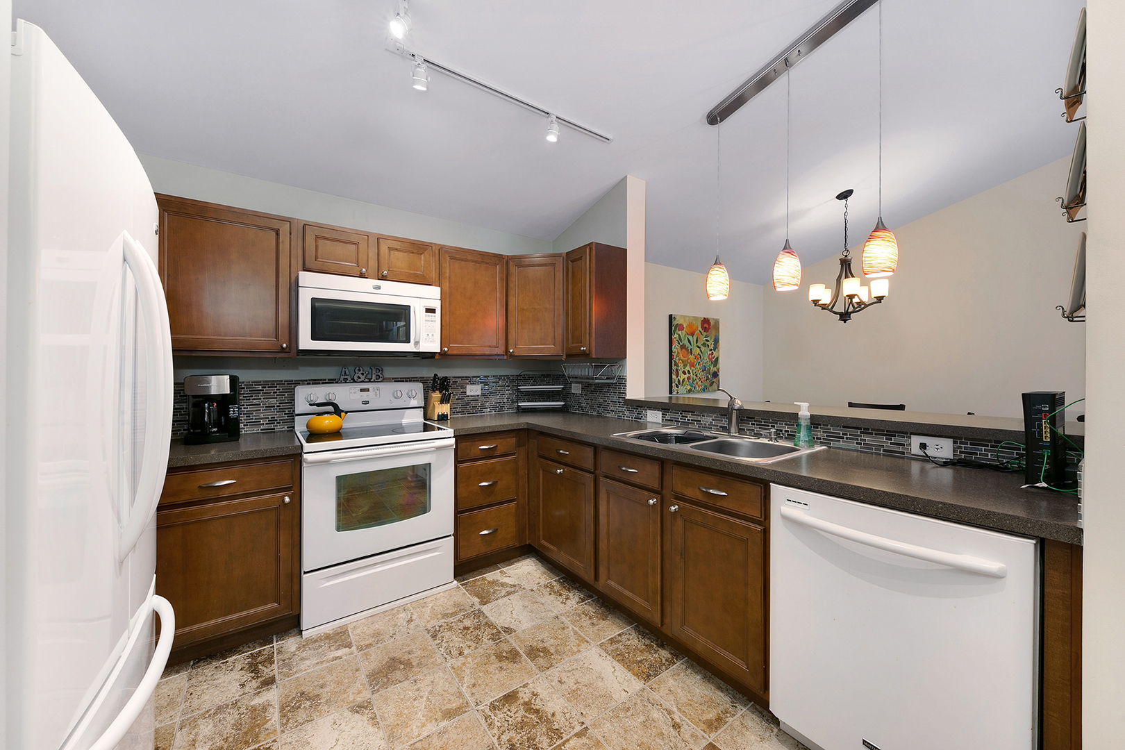 1488 McClure Road, Unit 1488 Aurora, IL 60505 - Photo 4 of 19 a kitchen with a sink stove and microwave