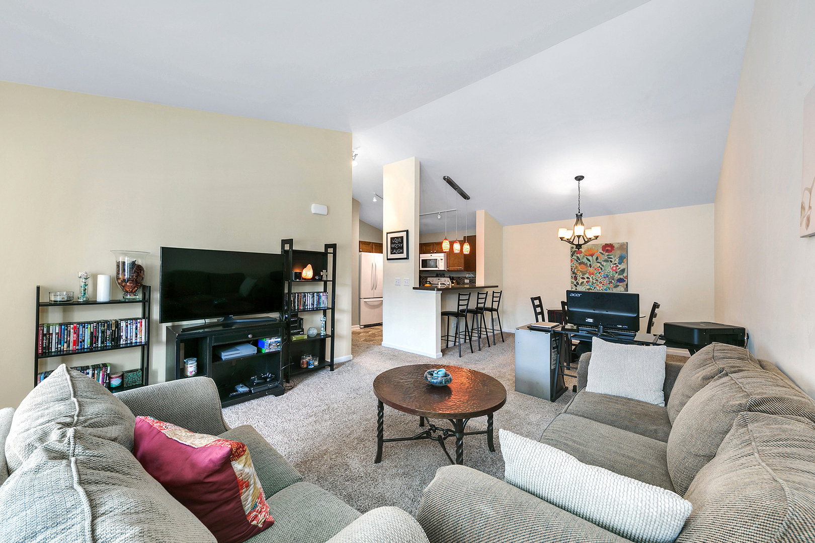 1488 McClure Road, Unit 1488 Aurora, IL 60505 - Photo 9 of 19 a living room with furniture and a flat screen tv