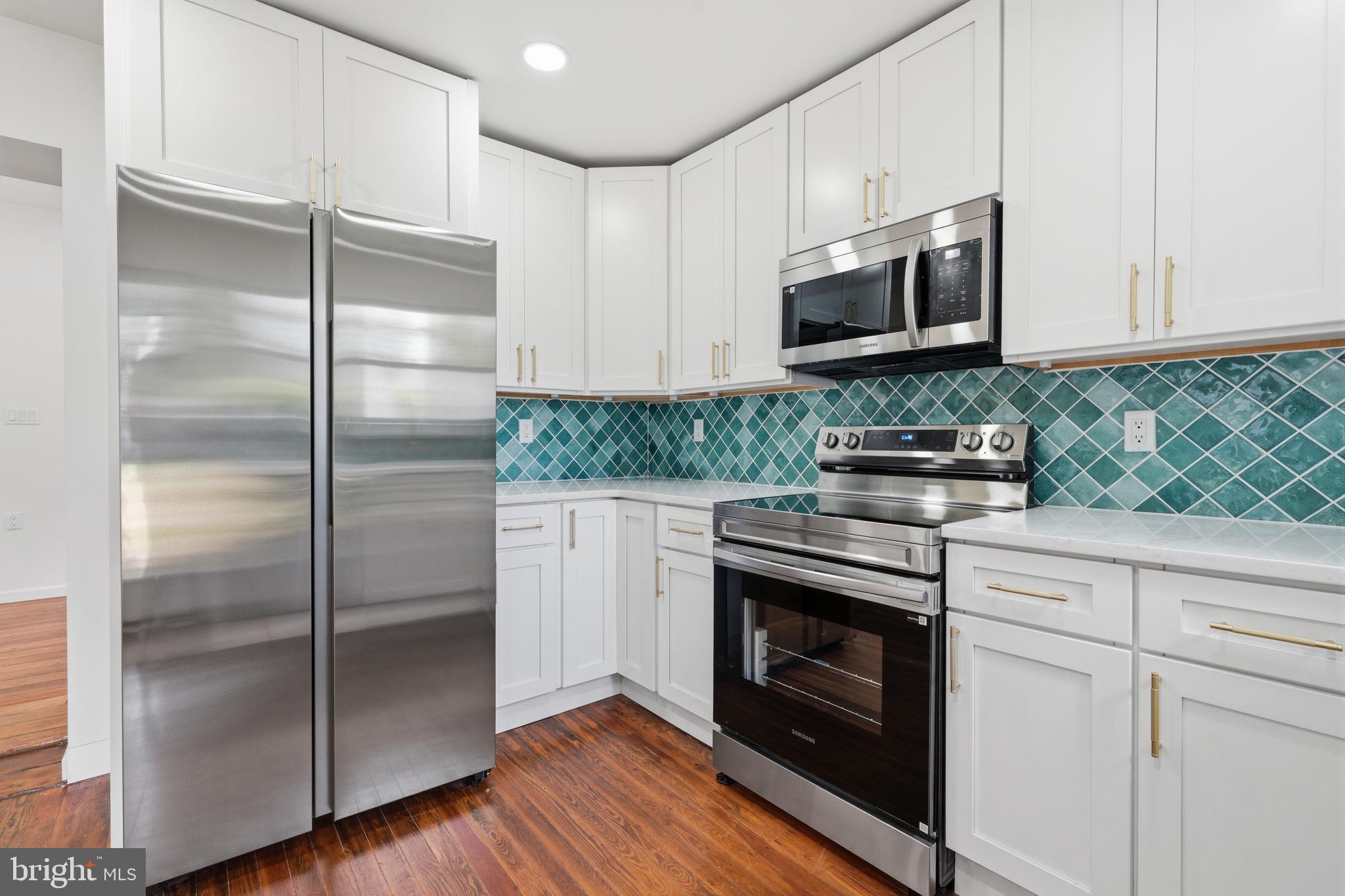 124 Cedar Road Riegelsville, PA 18077 - Photo 14 of 50 Modern kitchen with vibrant tiles.