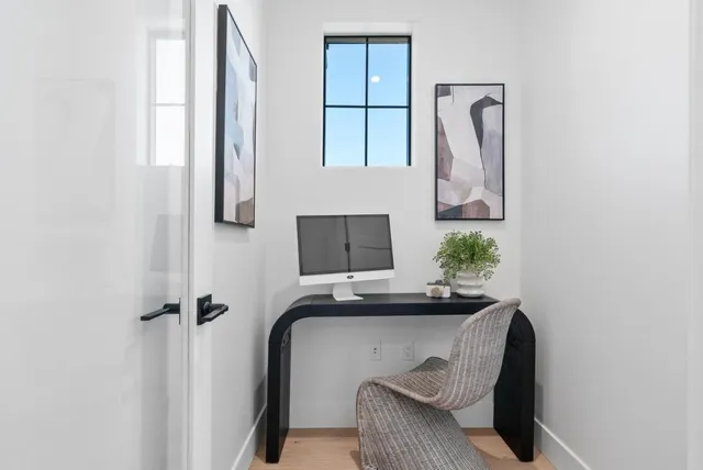 a bathroom with a granite countertop toilet sink and mirror