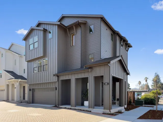 a room with potted plants and a table
