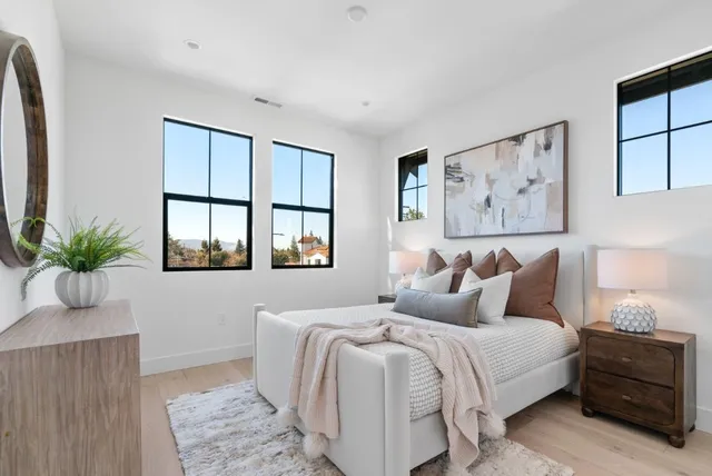 a bedroom with bed and window