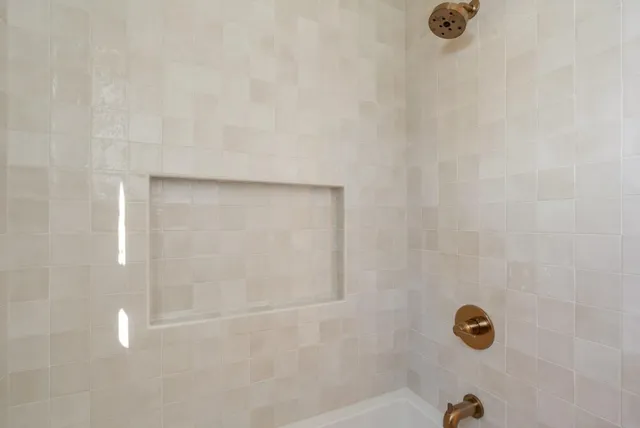 a bedroom with a bed and dresser