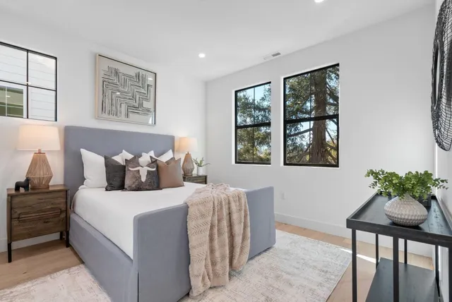 a bathroom with double sink and a mirror