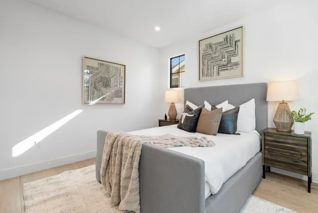 a white bath tub sitting next to a bathroom