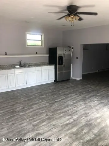 a view of a kitchen with a sink