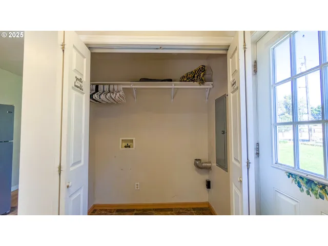 a view of a hallway with closet