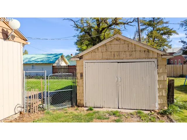 a view of walk in closet with clothes