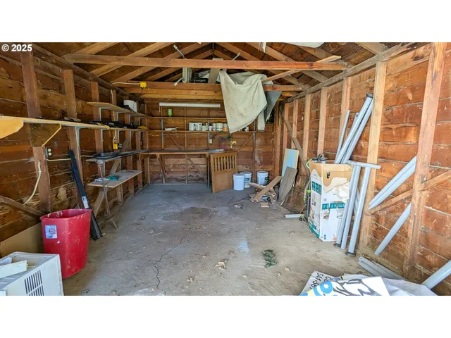 a backyard of a house with wooden floor and outdoor seating