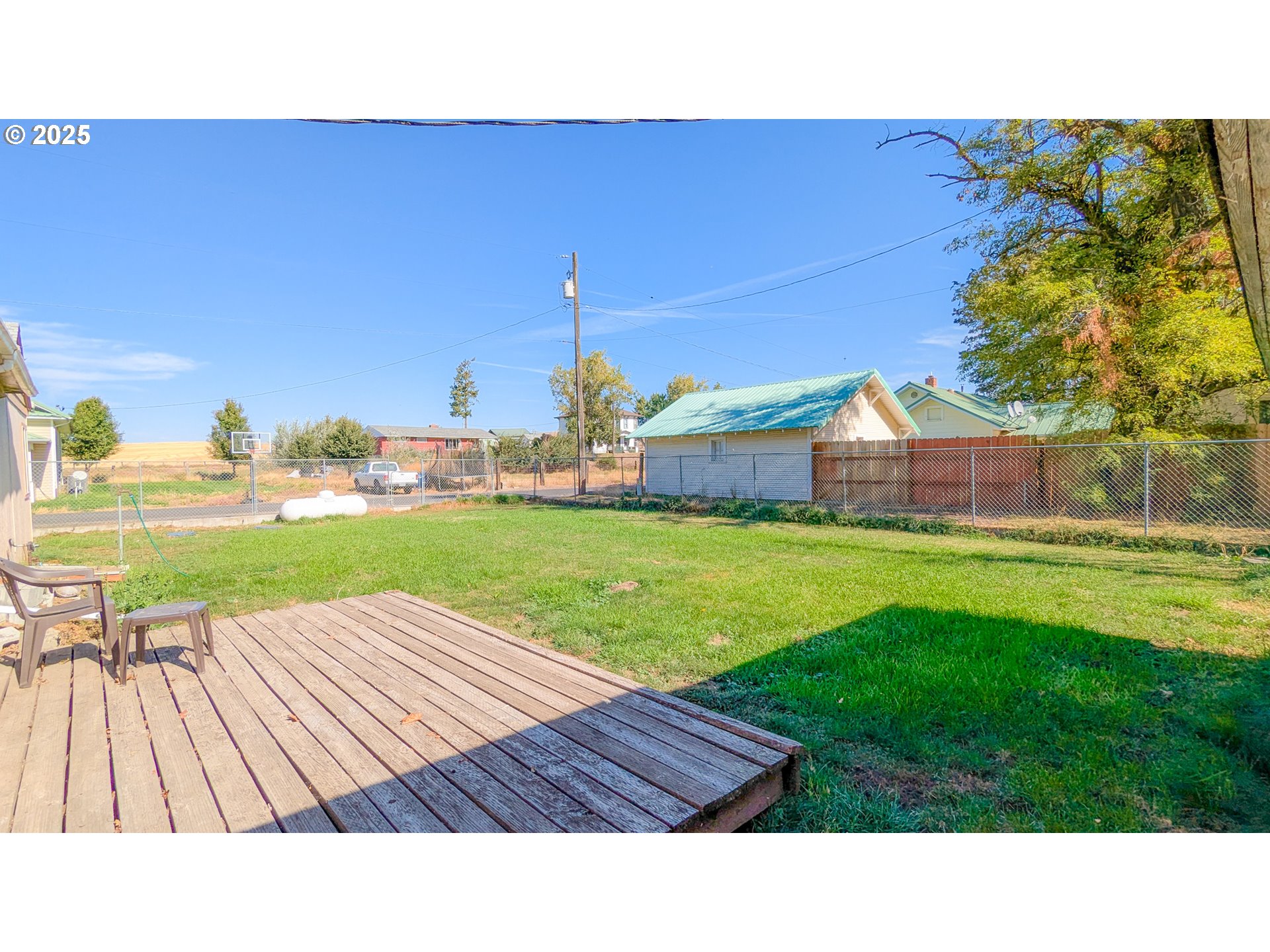 216 Solar Street Helix, OR 97835 - Photo 31 of 36 a backyard of a house with wooden floor and outdoor seating