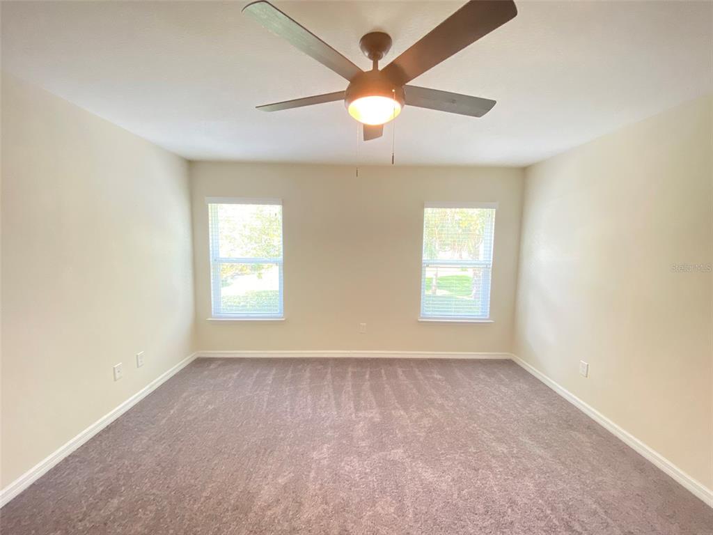 600 Northern Way, Unit 1001 Winter Springs, FL 32708 - Photo 29 of 37 an empty room with a window and a fan