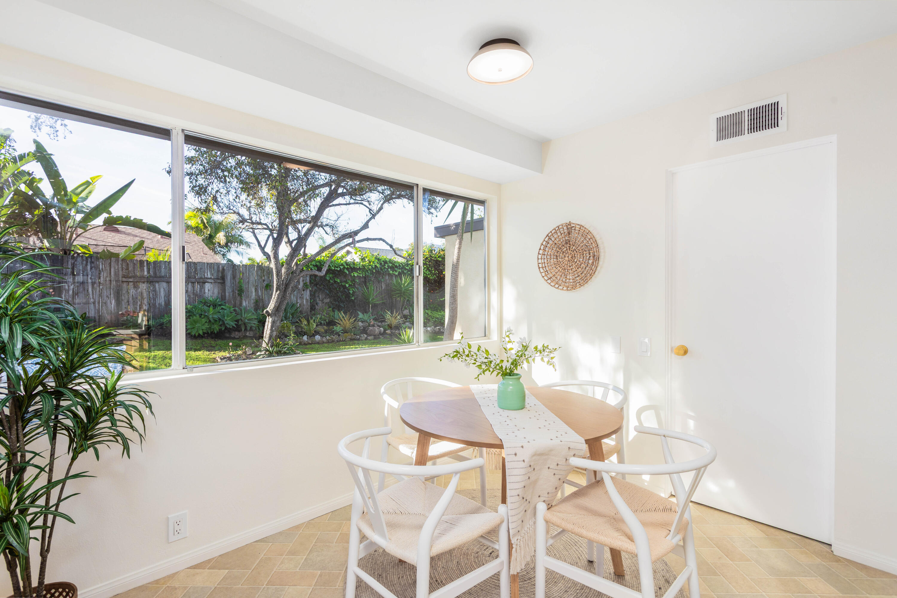1425 Azalea Drive Carpinteria, CA 93013 - Photo 11 of 28 a dining room with furniture and a large window