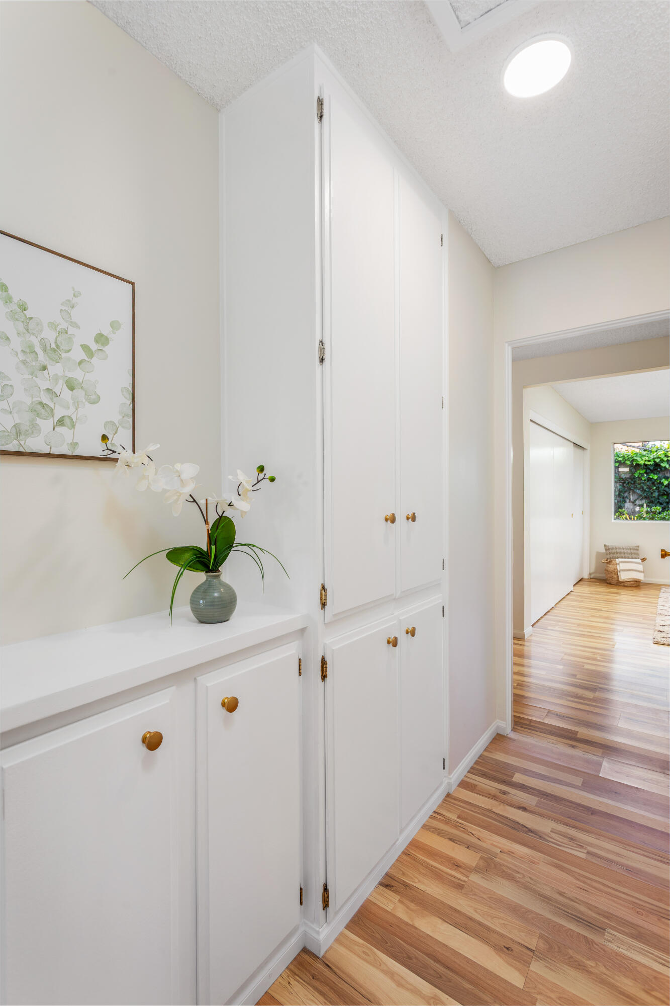 1425 Azalea Drive Carpinteria, CA 93013 - Photo 12 of 28 a room with white wall painting and a potted plant