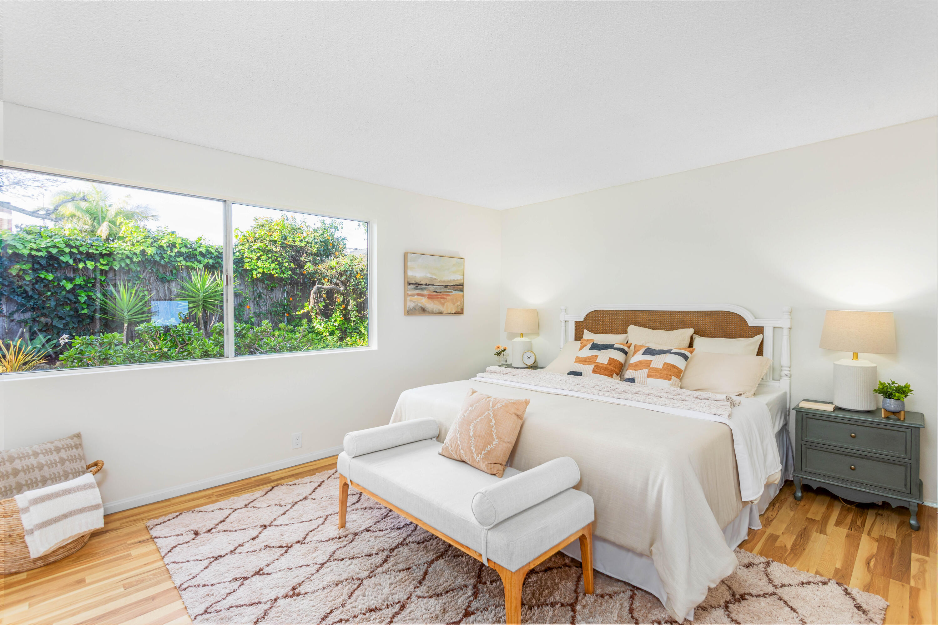 1425 Azalea Drive Carpinteria, CA 93013 - Photo 13 of 28 a bedroom with a bed and wooden floor