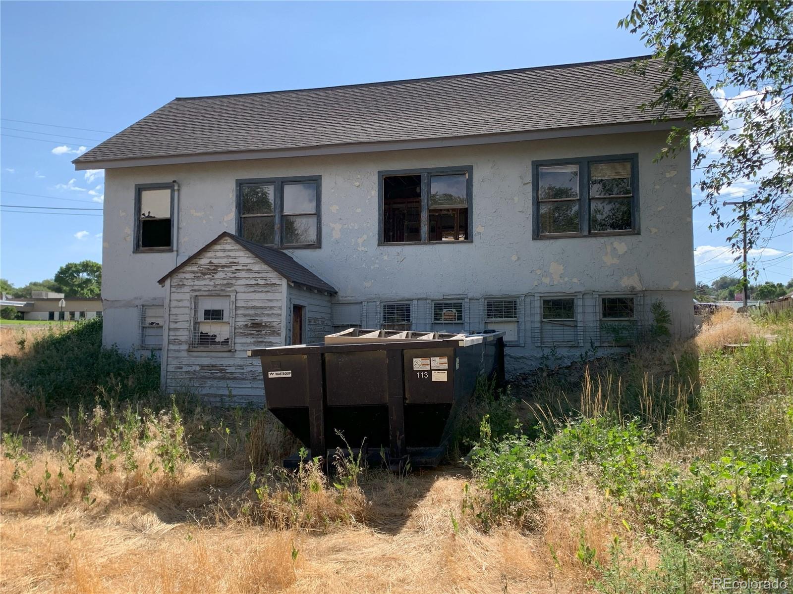 527 West Avenue Rifle, CO 81650 - Photo 4 of 10 a view of a house with a yard